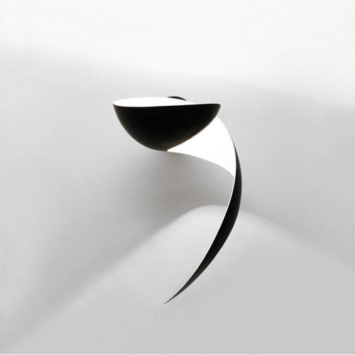 Wall lamp model 'flame wall lamp' designed by serge mouille in 1962. manufactured by editions serge mouille in france. The...