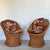 Pair of woven rattan wicker barrel chairs, 1970s Yugoslavia. Cushions feature bold floral print and are not original to...