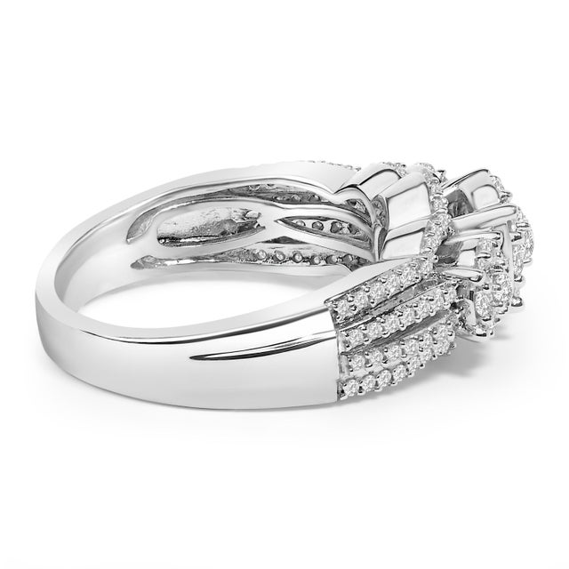 Expertly fashioned from .925 sterling silver, this resplendent engagement ring and wedding band set exudes timeless...