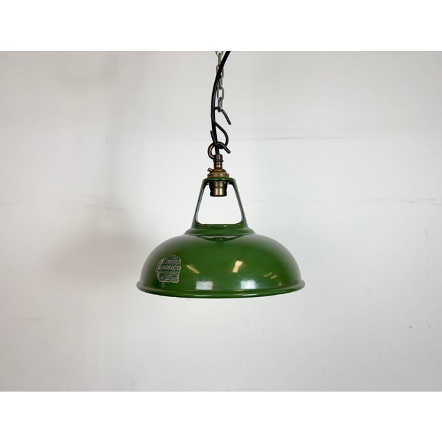 Industrial green enamel pendant light made by Coolicon in United Kingdom during the 1950s. White enamel inside the shade....
