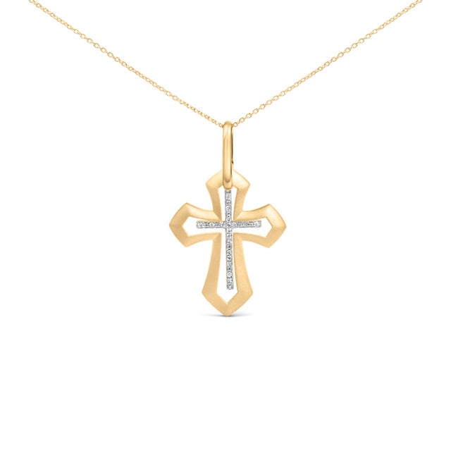 A study in quiet radiance, this pendant traces a Roman cross with flared, architectural arms and a softly pointed base,...