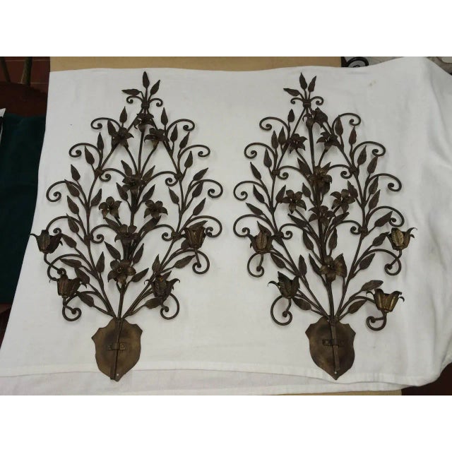 Pair of hand-wrought iron floral wall sconces. Magnificent sculptural pieces. Can easily be electrified. Offers below the...