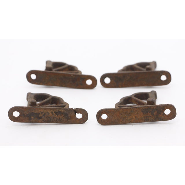 These cast iron hinge parts were taken from a parlor train car. They were used to control how far the upper windows in...
