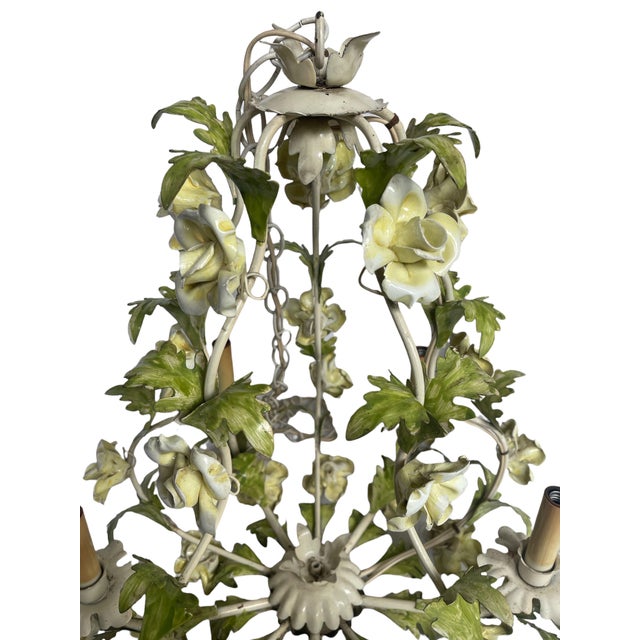 Mid century Italian tole chandelier. Cream, yellows and greens, this classic design includes roses and five arms for...