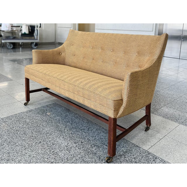 This Finn Juhn-style settee was originally crafted in the 1940s. It has been newly reupholstered in gold-and-black chevron...