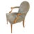 A pair of Rose Tarlow style upholstered armchairs with a round back, tapered and fluted legs and carved open arms with...