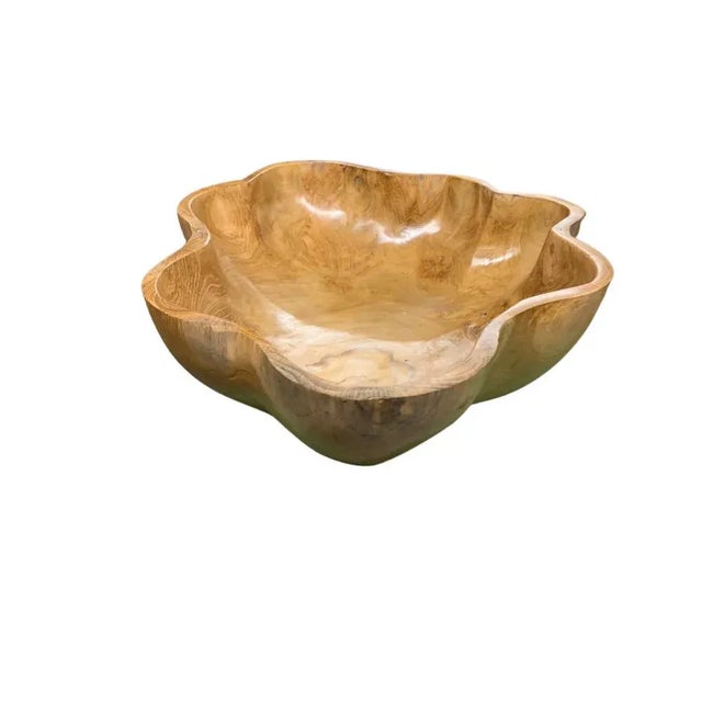 This teak live edge bowl is a unique piece showcasing the natural beauty of teak wood. Crafted by skilled artisans, its...