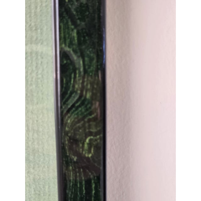 Elegant framed trio of botanical engraving-style floral prints displayed in a long vertical arrangement with green matting...