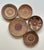 Boho chic style, set of five tightly coiled and stitched with natural grass fibers. Geometric patterns featuring brown,...