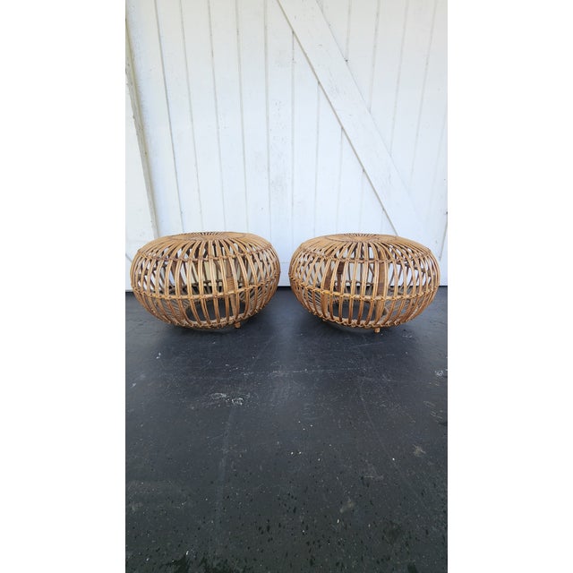 Gorgeous pair of Albini style rattan stools . stunning as a pair or used separately . The styling possibilities are...