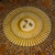 Large square coffee table by Fornasetti featuring the iconic sun motif and a subtly wavy perspex tabletop set on an iron...