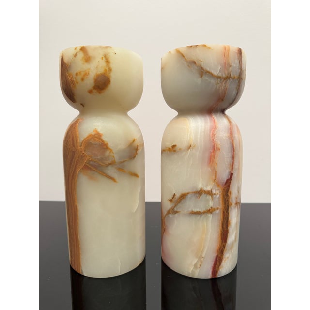 Pair of 12" tall stone candle holders. Unique beautiful veining on both. Top opening is approximately 3 & 7/8". The bottom...