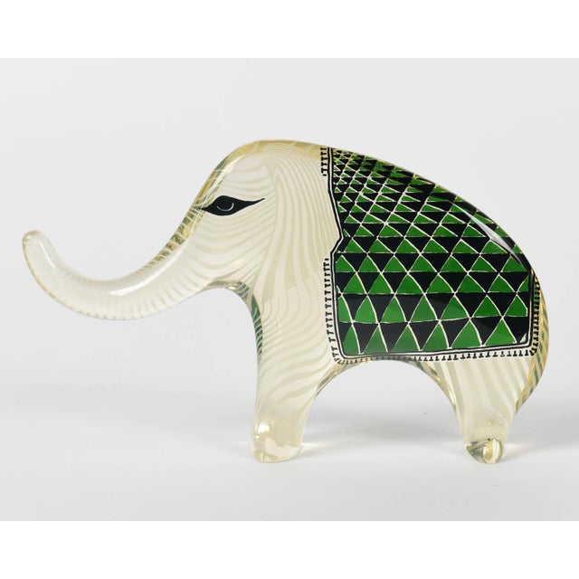 A Mid-Century Modern lucite Op Art elephant with green and black patterned blanket designed by Abraham Palatnik. Original...