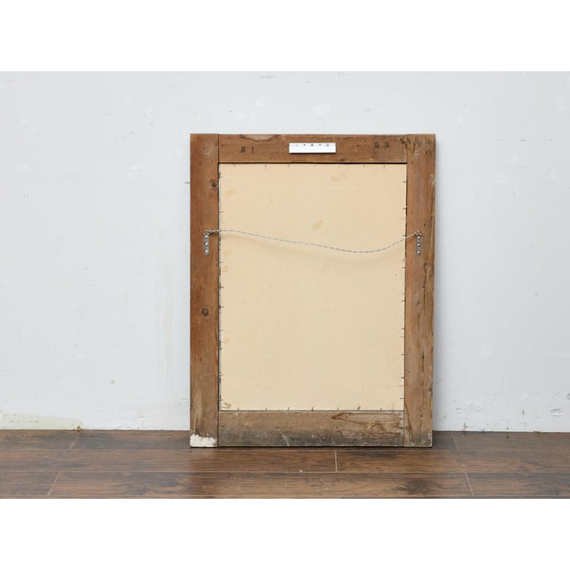 Dating to circa 1920, this French giltwood mirror features a crisply carved spiral frame set against a pale wood surround....