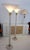 A stunning pair of monumental torchiere floor lamps. These oversized lamps were designed by Karl Springer for Karl...