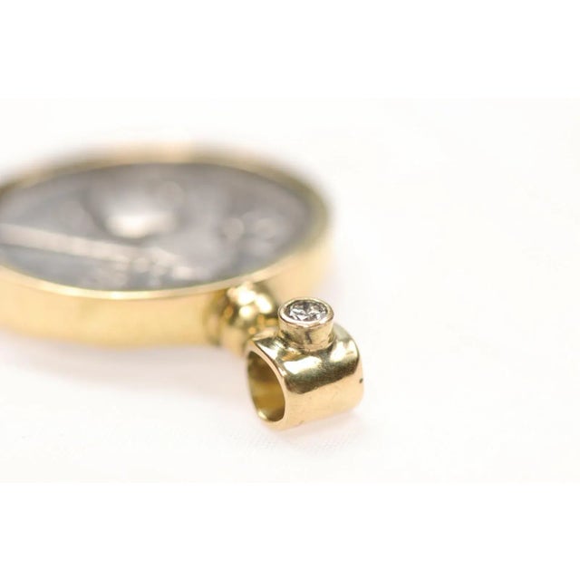 A Bee and Stag Silver Tetradrachm [coin] with round diamond & 18K gold detail. This coin was minted in Ephesus, Ionia,...