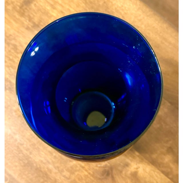 Add a sophisticated pop of color to any decor scheme with this elegant vase in a rich hue of cobalt blue. The intense...