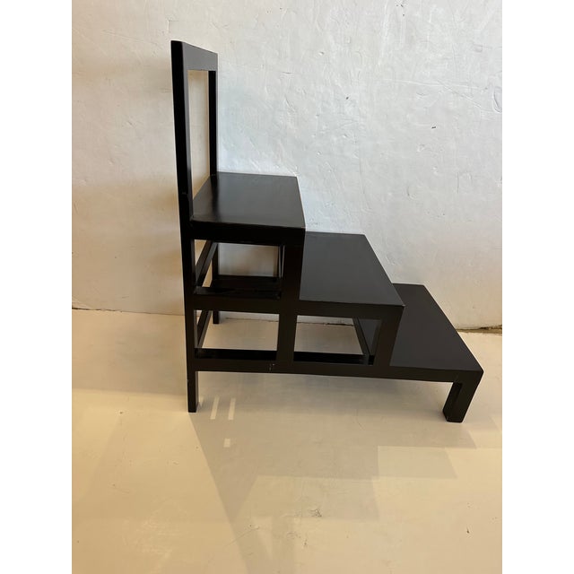 Handsome sturdy ebonized wood library steps or side table having 3 steps.