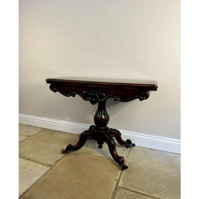 Antique Victorian quality carved rosewood card table, having a quality rosewood folding top with a thumb moulded edge...