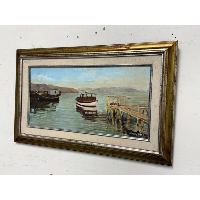 Design Plus Gallery presents a Vintage Coastal Seascape Oil Painting by artist F. Yayboke. This framed seascape depicts a...