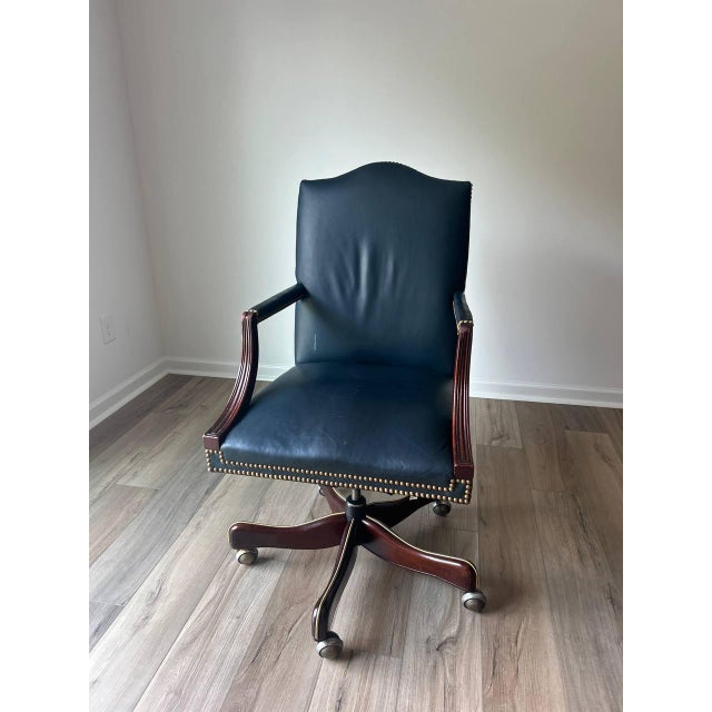 A classic and well-crafted swivel desk chair by Hickory Chair, known for their high-quality American leather upholstery...