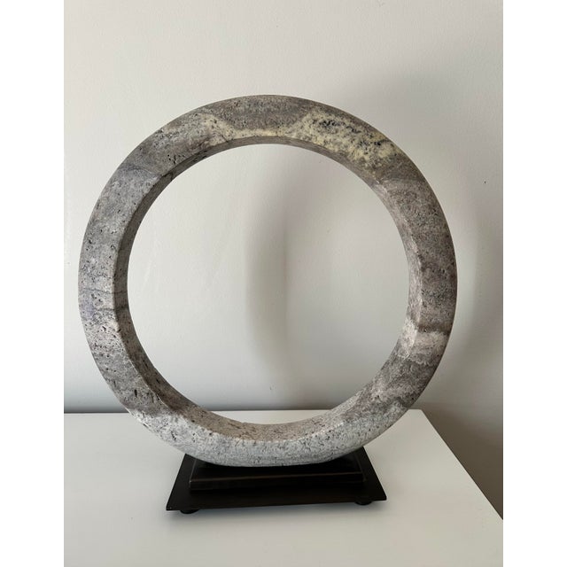 The beautiful stone sculpture shows natural texture and distressing in shades of charcoal gray, brown, and blue and is...