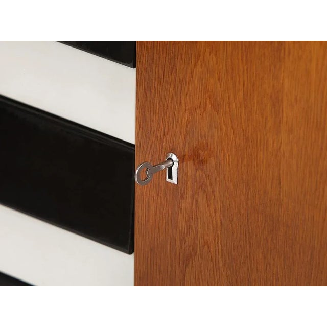 This original sideboard from UP zavody was stylistically modified and completely restored by us. This piece has an...