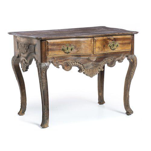 18th century Portuguese, in carved walnut wood with two drawers. Cut-out skirts, decorated with shells and plant scrolls....