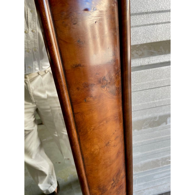 A large scale English yew wood framed mirror that can be hung on the wall or used as a full-length floor mirror. What adds...