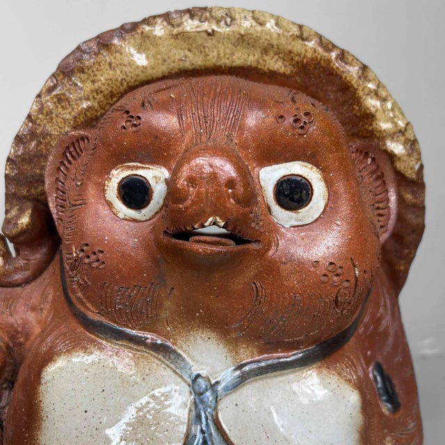 Large traditional Tanuki Statue made of Shigaraki Pottery, 1980s, Shōwa Period, Japan. This Tanuki statue, crafted from...