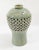 We are selling this attractive decorative Korean mid-century celadon green glazed vase with openwork basketwork and...