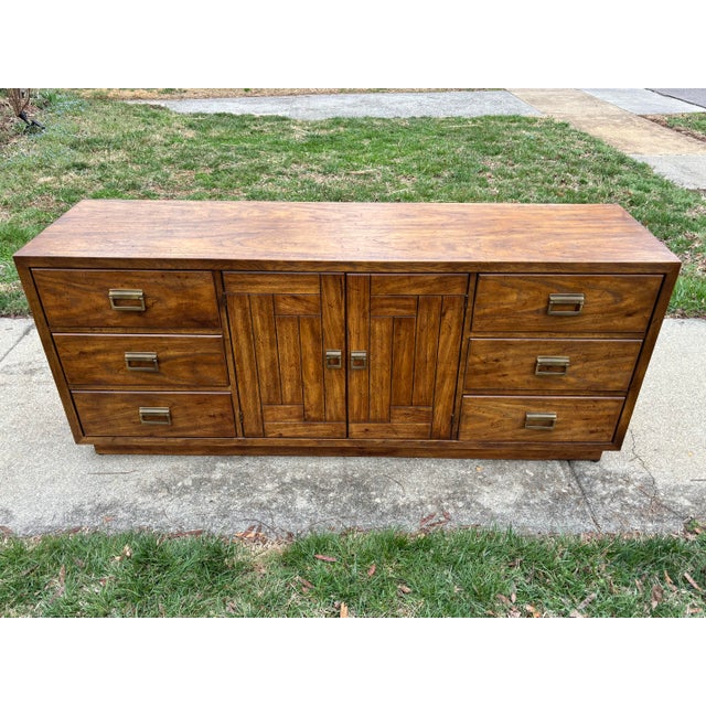 Vintage Drexel Heritage Woodbriar lowboy pecan dresser. This dresser has nine drawers, with the center three concealed...