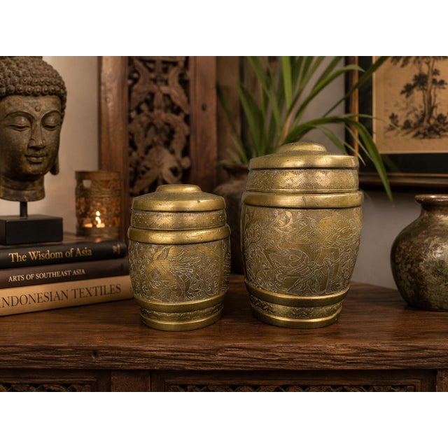 This charming set of two vintage brass covered jars features intricate hand-engraved decoration inspired by traditional...