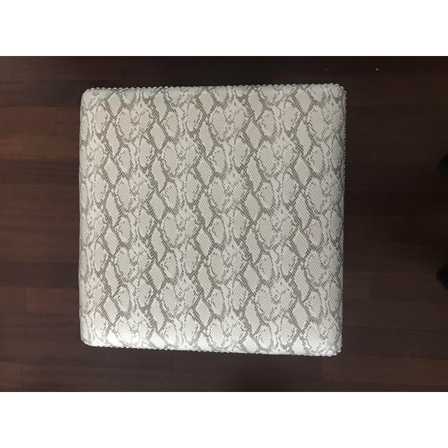 Modern stylish vinyl like silver grey faux snake printed pattern ottoman or stool. From upper west side luxury Manhattan...