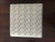 Modern stylish vinyl like silver grey faux snake printed pattern ottoman or stool. From upper west side luxury Manhattan...