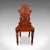 This is an antique shield back hall chair. A Scottish, walnut side or reception seat, dating to the High Victorian period,...
