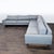This Room & Board sectional features a clean, modern design with soft gray fabric and a sturdy wooden base. The L-shaped...