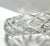 A striking heavy cut crystal ashtray featuring a radiant starburst pattern that refracts light beautifully from every...