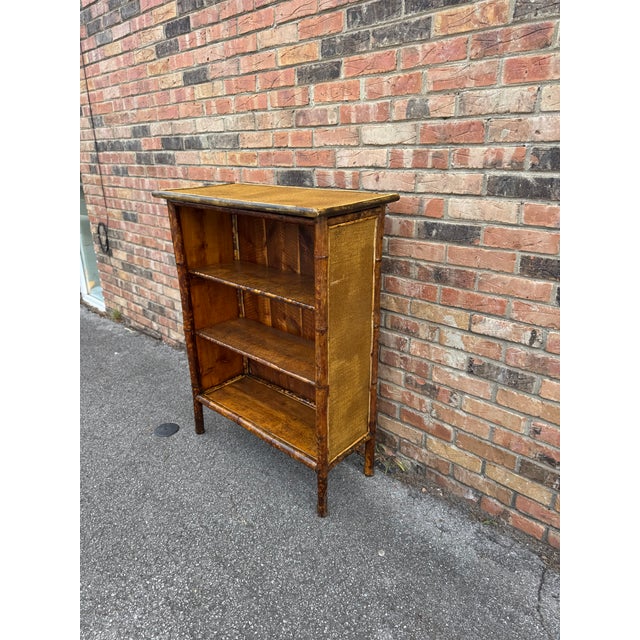 This is a 19th Century English tortoise shell bamboo book shelve/display cabinet totally restored in a excellent condition
