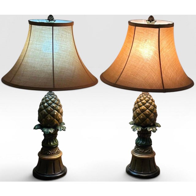Vintage Hollywood Regency Painted Composition Pineapple Lamps - A Pair Infuse your home decor with a lively sense of...