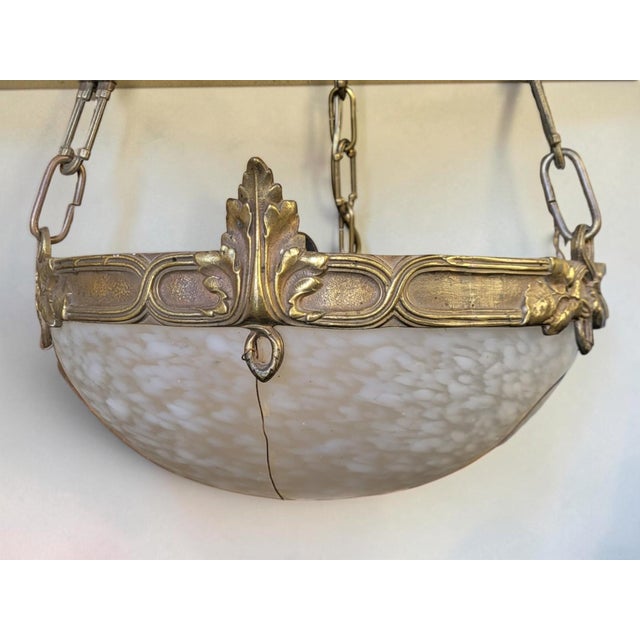 Art Deco pendant light in patinated gilt bronze with a Clichy glass shade. Height approximately 71 cm / Diameter 31 cm. In...