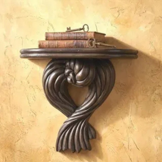 This is an original 1970s Italian hand-carved wood wall shelf bracket — a substantial, deeply sculptural piece in the Old...