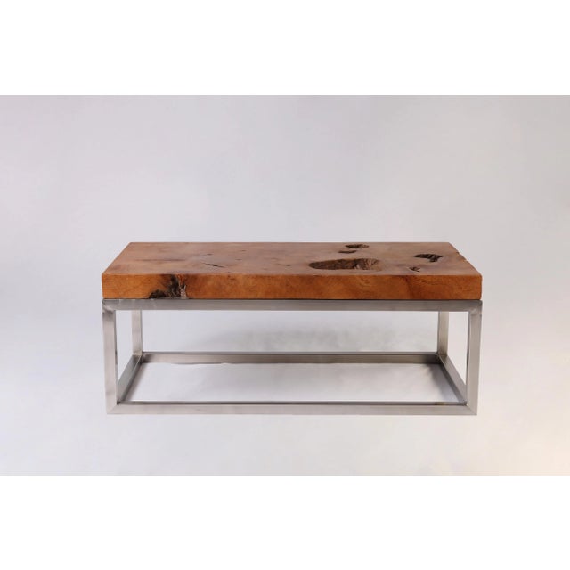 This gorgeous coffee table is hand made from one single slab of teak wood. Both sides of the top are hand polished and can...