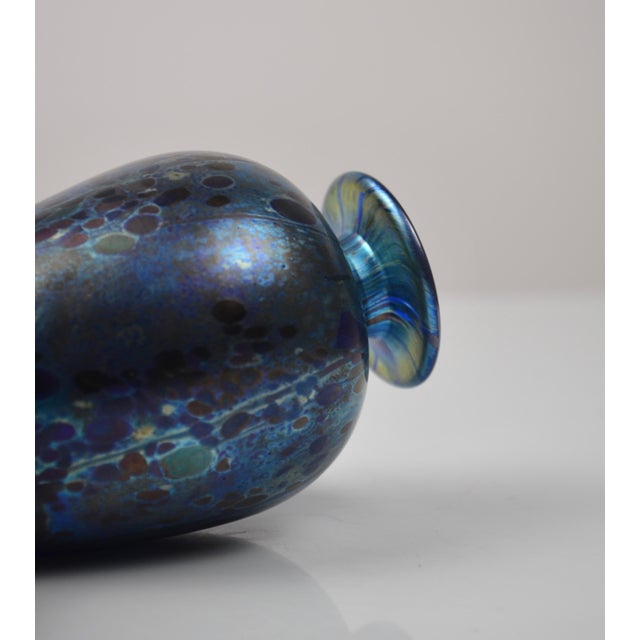 Elegant vintage perfume bottle by Isle of Wight Studio Glass, showcasing the studio’s mastery of iridescent surfaces and...