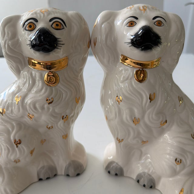 Pair of vintage Beswick Staffordshire-style spaniel mantle dogs, made in England. Each ceramic figure features a glossy...