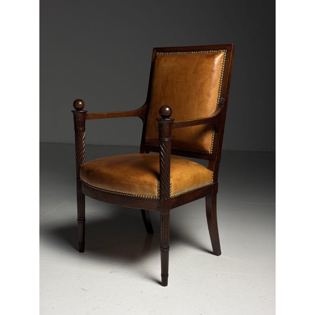 French armchair / office chair. Frame crafted from mahogany. Seat and back are upholstered in sheepskin. Finished all...