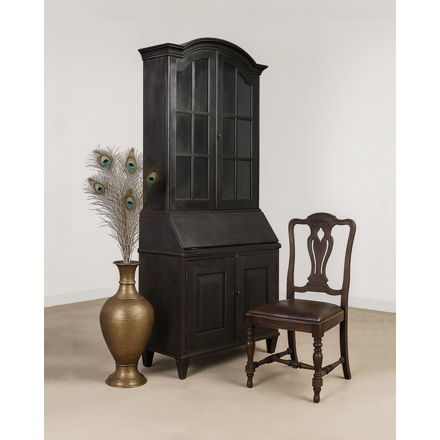 Imposing industrial style secretary bookcase cabinet with a 2 part construction. Crafted in India from iron featuring a...