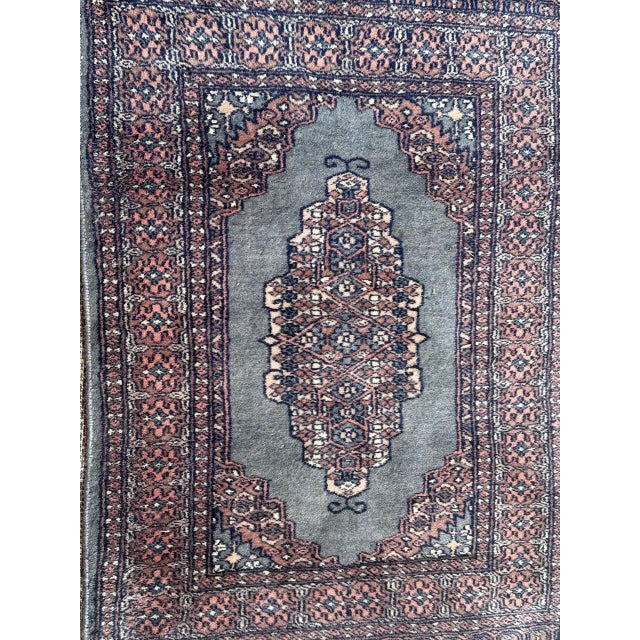 Nice vintage small Pakistani rug with a Turkmen geometrical design and nice colours with a blue field, entirely and finely...