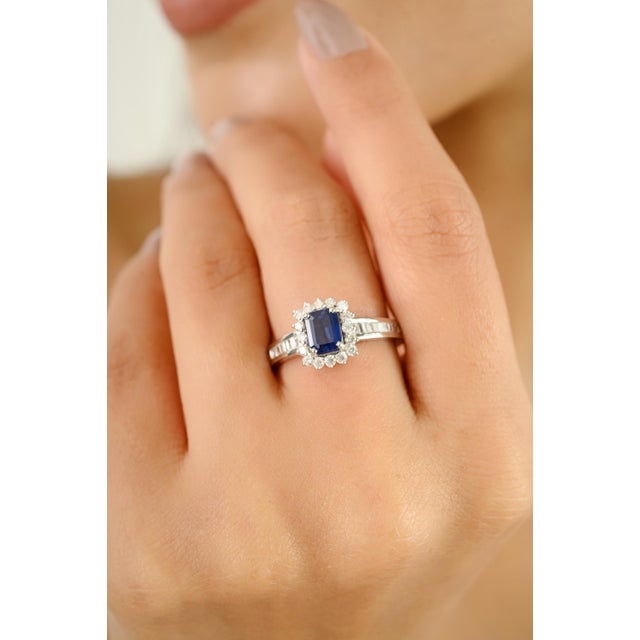 Crafted in luminous 14k white gold, this exquisite ring showcases a richly hued 0.95-carat sapphire at its center, cut in...