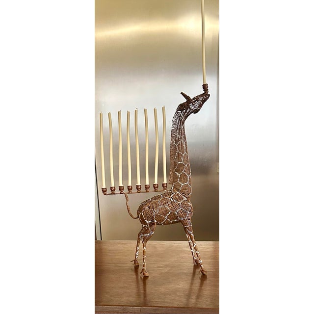 Add a bit of whimsy to your decor, with this wire-sculptured, giraffe menorah—adults as well as children will adore it!...